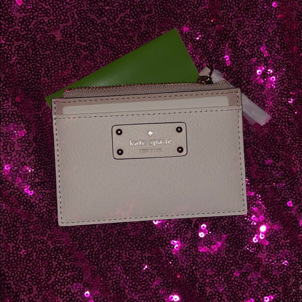 Brand new never used kate spade coin purse.